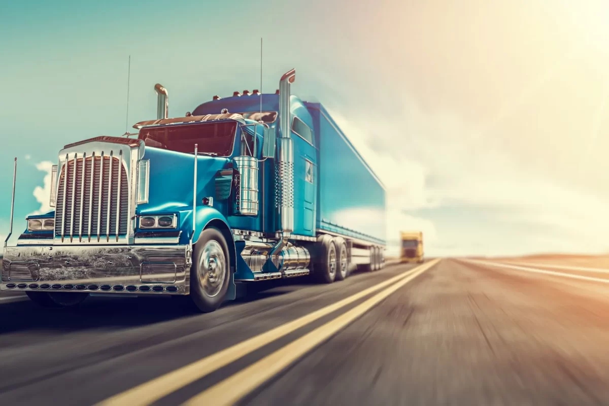 Blue truck driving on a highway