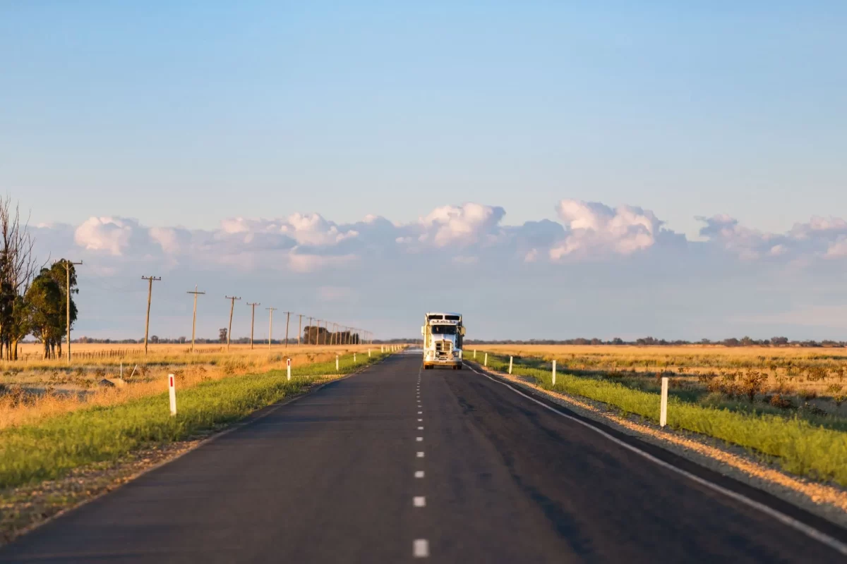 Truck driving on a quiet road